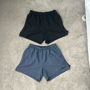 Men’s Nike sport shorts with 4” inseam on both. Tags removed, no liners.